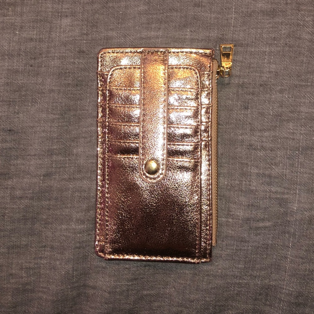 Shimmery rose gold wallet.
